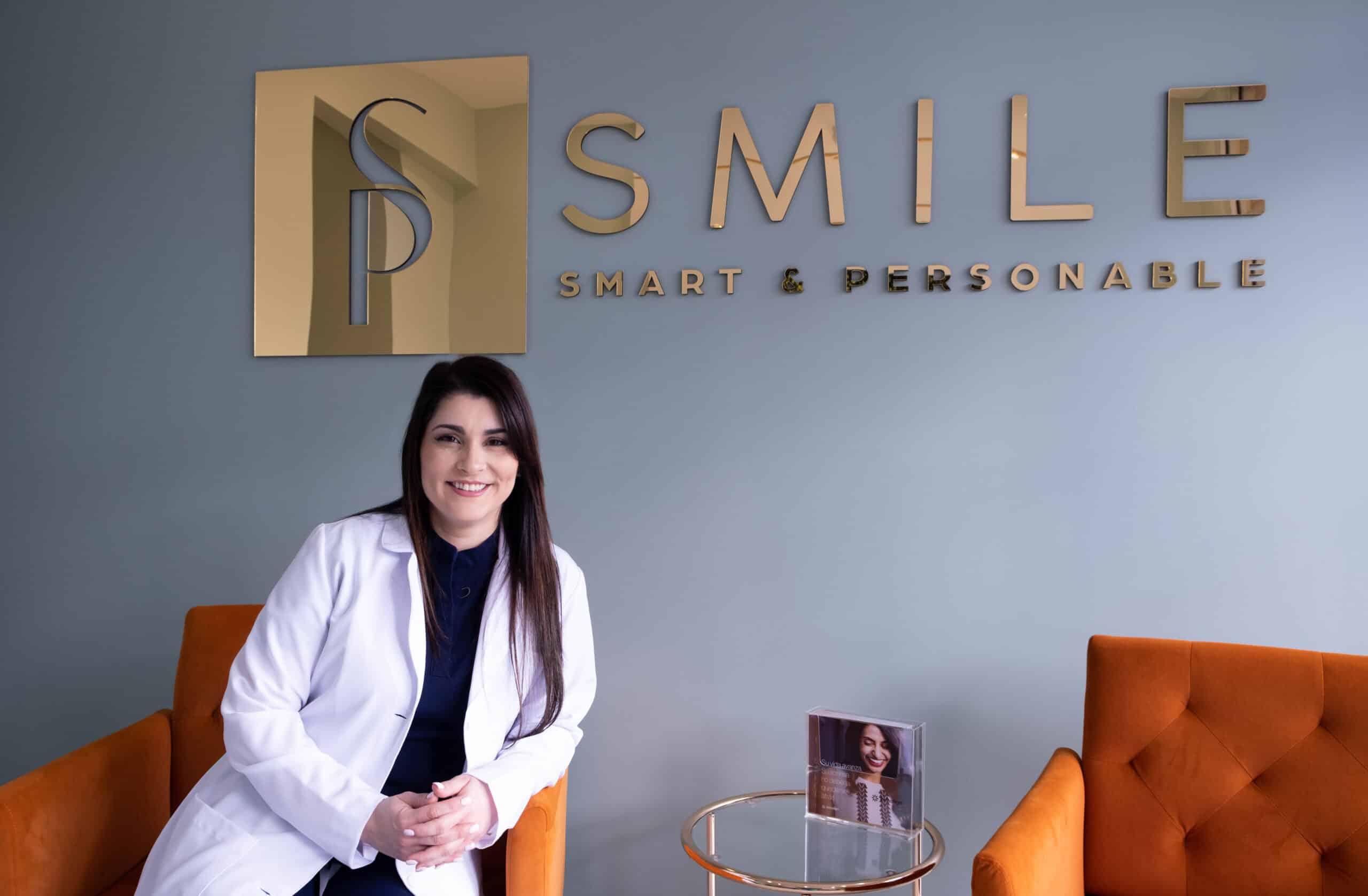 Dr. Susel Perez at SP Smile Dentistry modern lobby.