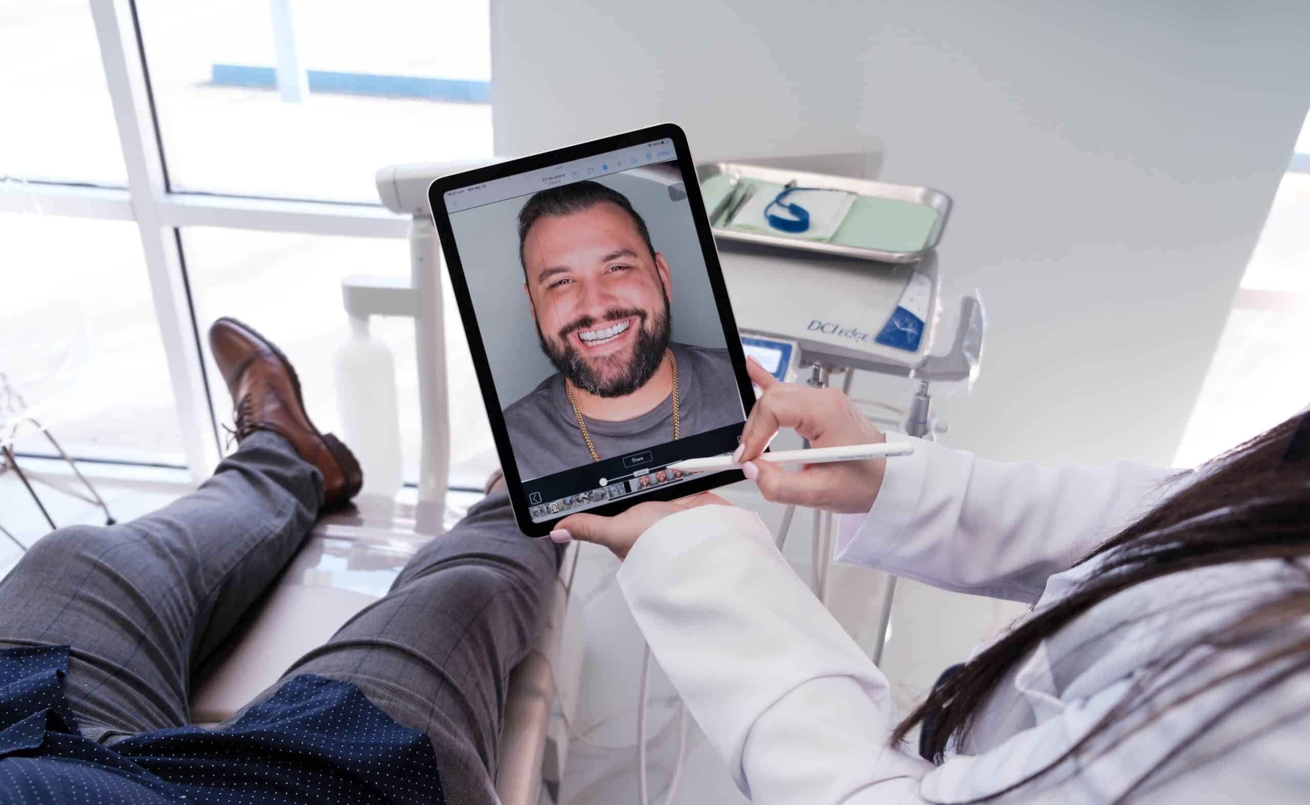 Man smiling receiving a dental consultation at SP Smile Dentistry